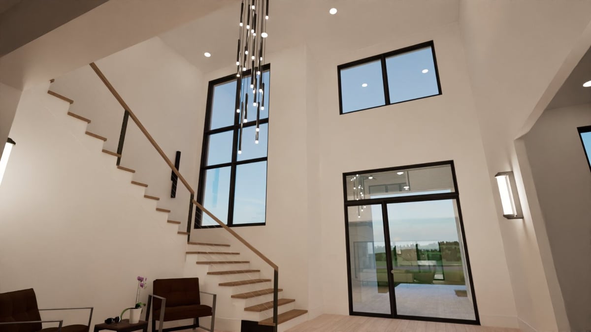 Bort Design custom home foyer with a floating staircase, modern chandelier, and dramatic two-story windows in Longview, TX.-optimized