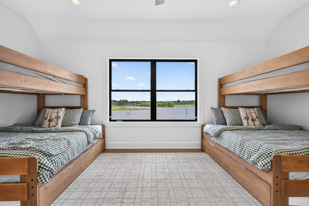 custom bunk bedroom with twin beds overlooking lake in longview texas custom home