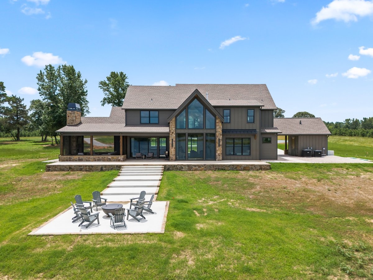 rear exterior of custom home with patio and lake views in longview texas custom home