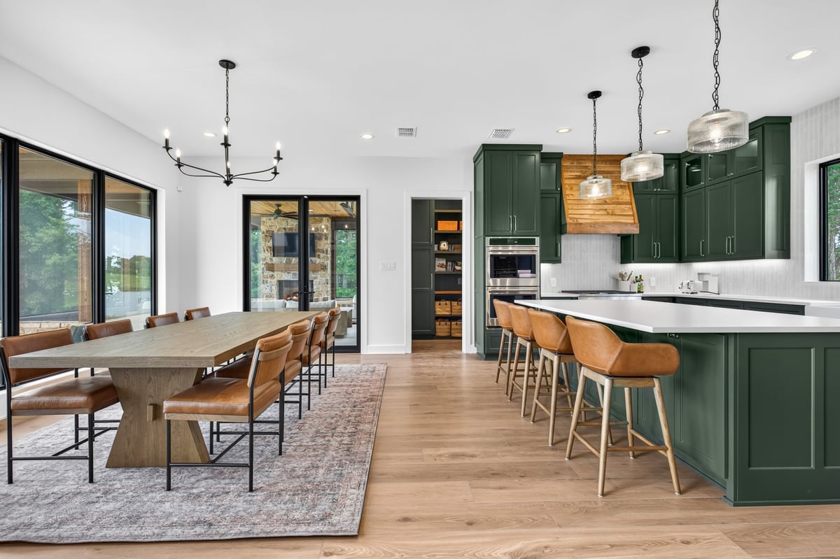 spacious green kitchen with island seating in longview texas custom home