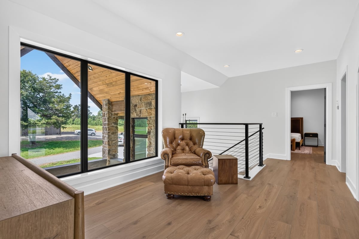 upstairs loft sitting area with large windows in longview texas custom home