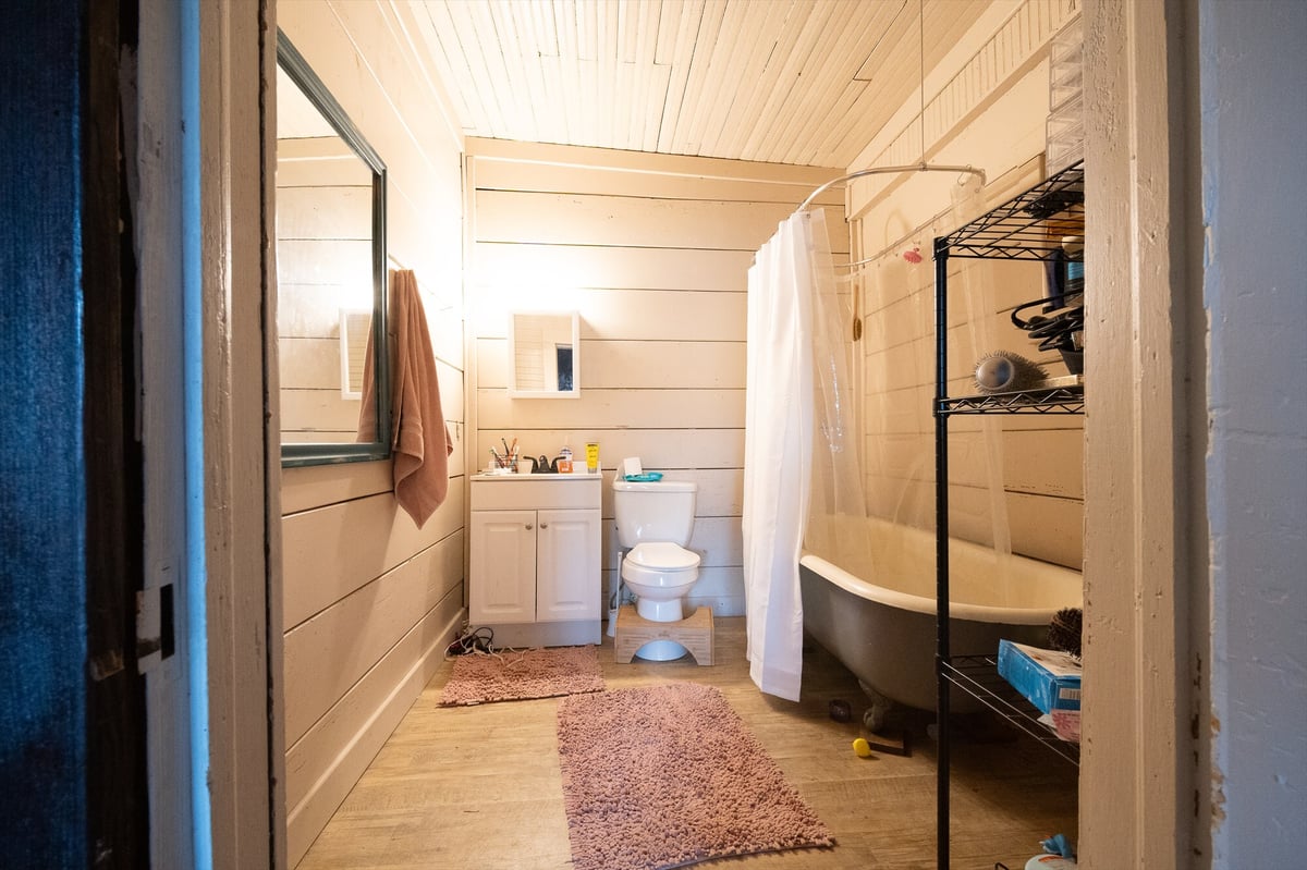 before east texas home remodel bathroom clawfoot tub shiplap walls white vanity bort custom homes