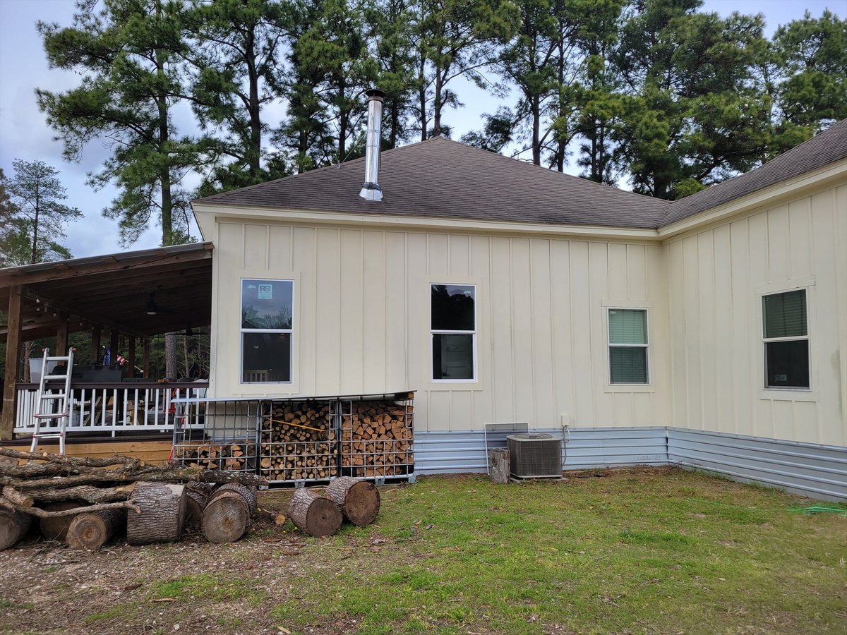 before east texas home remodel rear exterior firewood racks metal skirting bort custom homes